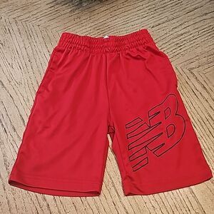 Red athletic shorts New Balance size M 5/6